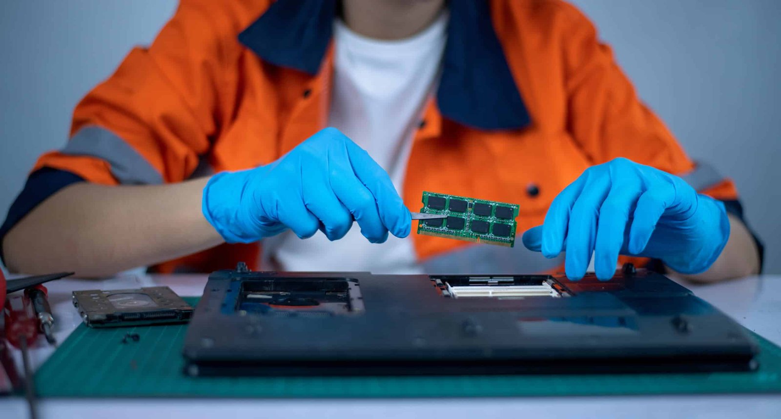 the-engineer-repairs-the-laptop-pc-computer-and-2023-11-27-05-34-20-utc
